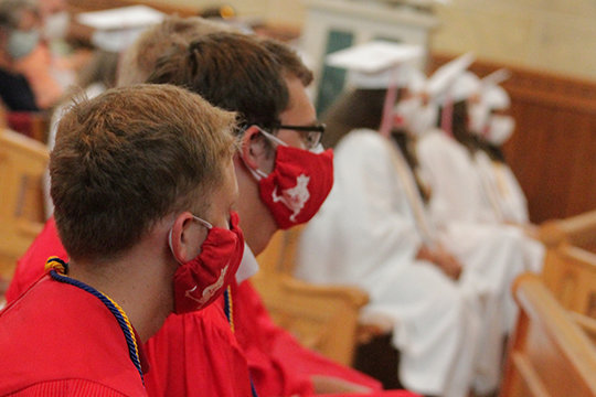 Members of Sacred Heart High School’s Class of 2020 listen to the homily during their Baccalaureate Mass on July 25 in St. Vincent de Paul parish’s Sacred Heart Chapel in Sedalia.